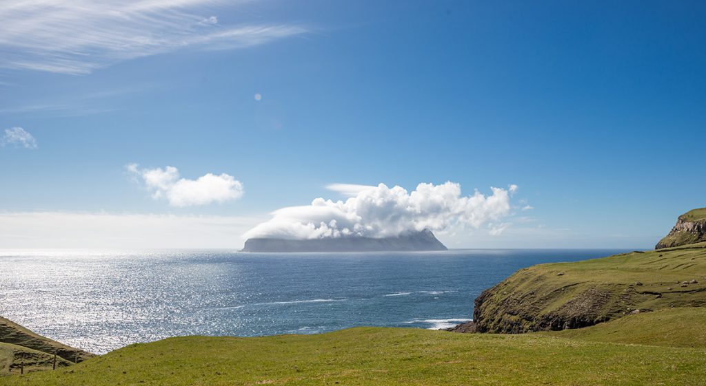 Mykines island covered by clouds